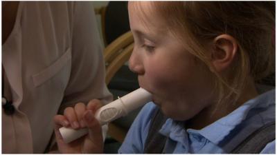 Child performs breath test