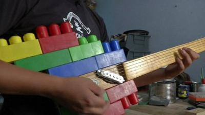 Guitar made of wood and plastic bricks