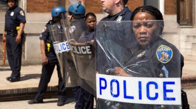 Police with shields in Baltimore