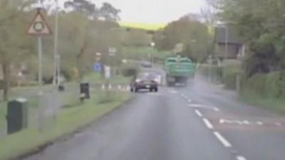 Footage of lorry on wrong side of road at roundabout