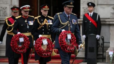 Military gather to lay a wreath during a tribute at the Cenotaph