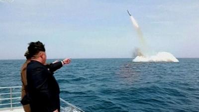 Kim Jong-un watches key submarine missile launch