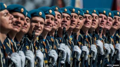 Line of Russian soldiers carrying guns during Victory Day parade in Moscow's Red Square