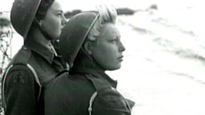 Women look out over UK beach