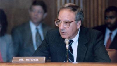 Senator George Mitchell seated at a committee meeting in 1984