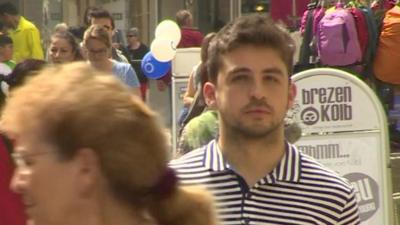 Syrian refugee, Mohammed Srour Mallah, walking down a street in the German town of Furth