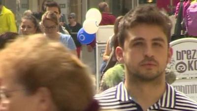 Syrian refugee, Mohammed Srour Mallah, walking down a street in the German town of Furth