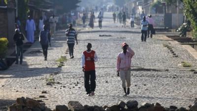 People walk in the streets in Bujumbura