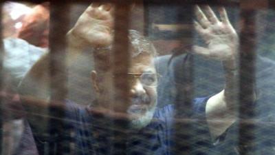 Mohammed Morsi waving