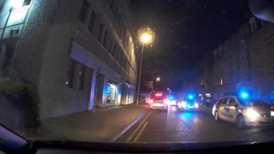 Oncoming police cars