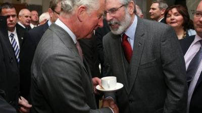 Prince Charles and Gerry Adams shake hands