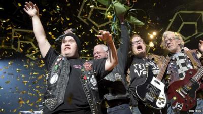 Members of Finnish punk rock band PKN celebrating winning a place in the Eurovision Song Contest