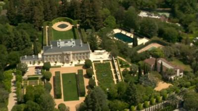 House with lawns and a pool