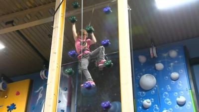 Child in a play centre that is run by the community