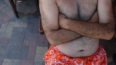 barechested man with slight tummy