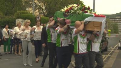 Danny Jones' family follow his coffin