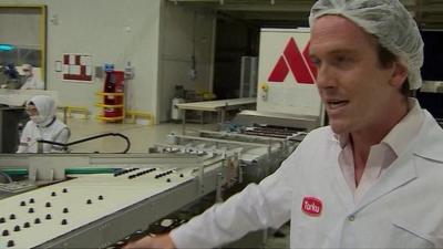 Mark Lowen in hairnet on chocolate production line