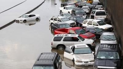 Car stranded and abandoned in floodwater