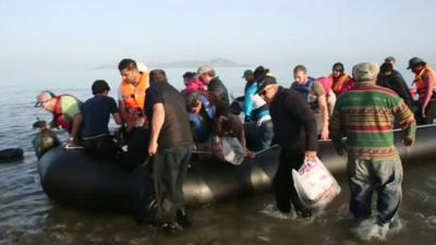 A boat full of migrants arriving in Kos