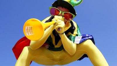 Man playing vuvuzela at SA world cup