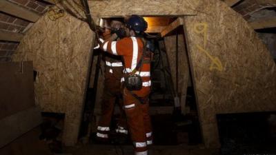 Workers in a tunnel