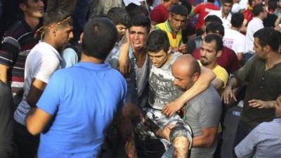 Injured man carried at Turkey rally