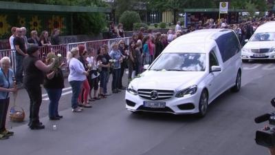 Cortege carrying the coffins of 16 schoolchildren and two teachers arriving in Haltern
