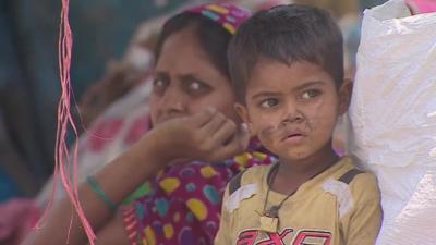 Small child and woman in India