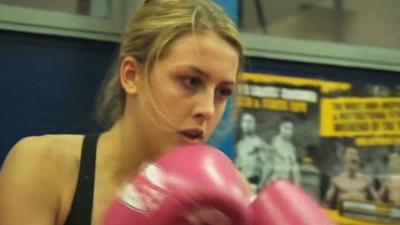 a woman Thai Boxing