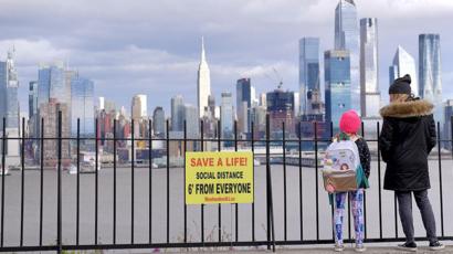 Woman and girl look at view of Manhattan, New York