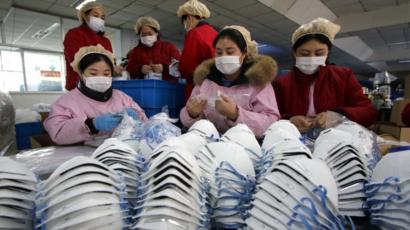Workers make face masks in China