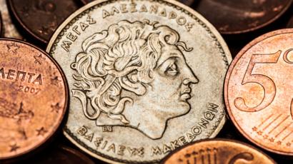 Moneda antigua con el rostro de Alejandro Magno