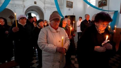 People attend a service on the eve of Catholic Easter, amid the coronavirus disease (COVID-19) outbreak, in the village of Dvorets, Belarus
