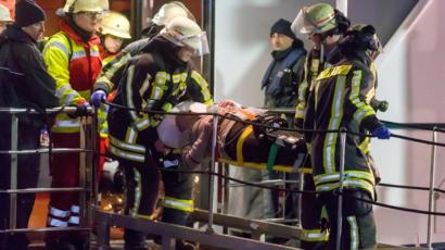 An injured passenger is evacuated on a stretcher during the rescue operation after the Swiss passenger ship Swiss Crystal hit a motorway bridge pylon on the Rhine River in the western city in Duisburg, Germany, 26 December 2017