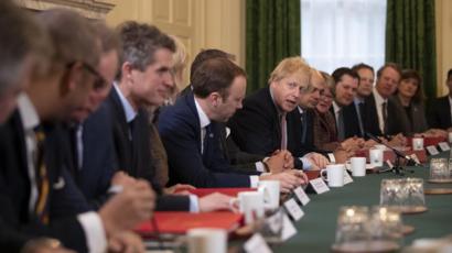 Boris Johnson running a cabinet meeting with colleagues