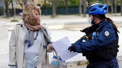 Police officer questioning woman, Paris