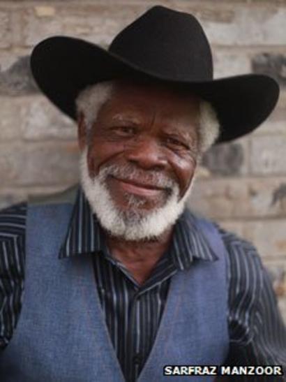 black man in cowboy hat