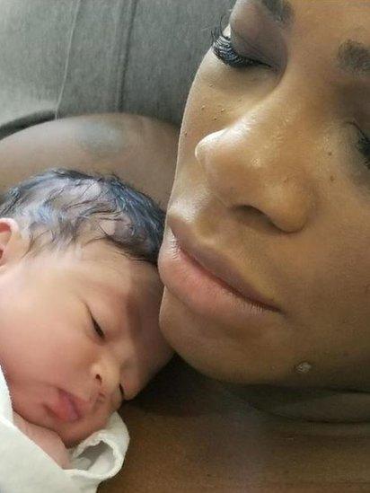 Serena Williams holding her baby daughter