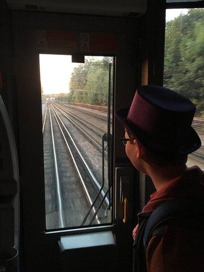 Alasdair Clift riding a London Underground train