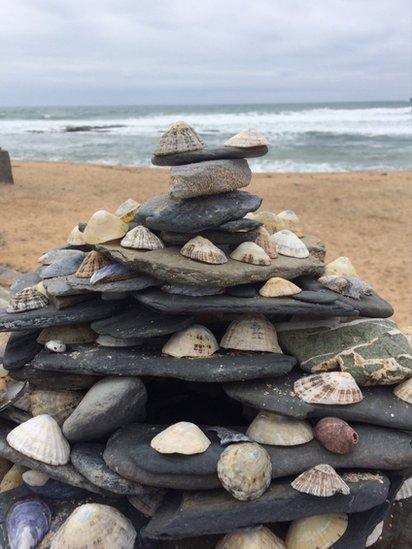 Stone and shell tower on a beach