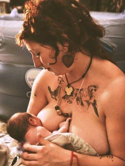 Eleanor Horrigan breastfeeds her baby after giving birth