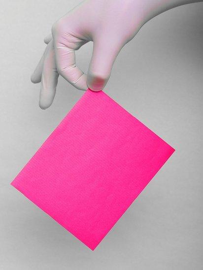 Hand holding a piece of paper