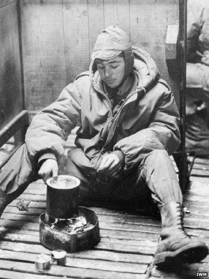 Argentine soldier cooks a meal