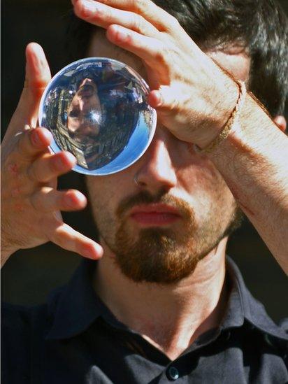 Man holding a looking glass