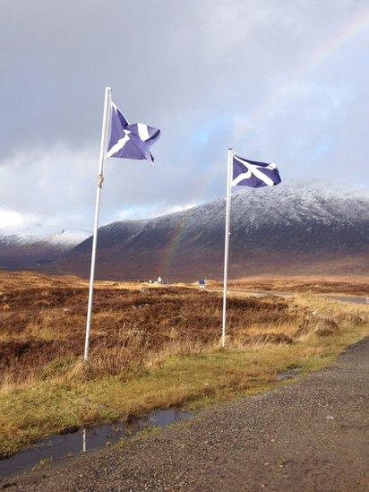 Rainbow and saltire flags in Glencoe