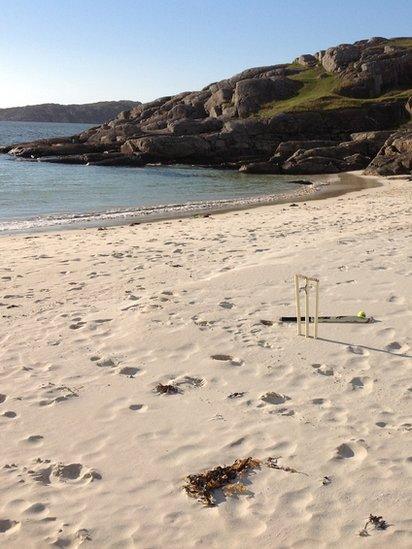 Cricket stumps on a beach