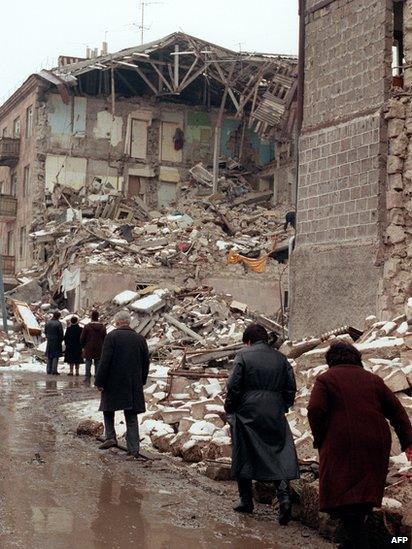 Survivors walk in the devastated town of Leninakan, on December 15, 1988, after an earthquake hit Armenia, on December 7, 1988.