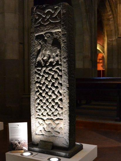 The recumbent stones, which often show hunting scenes and interlace patterns, were designed to be placed over a burial coffin