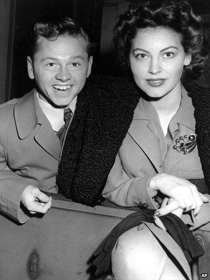 Mickey Rooney and wife, Ava Gardner, arrive in New York in January 1942, en route to Boston where Rooney is to appear at a Red Cross benefit