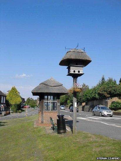 This dovecote and thatched bus shelter sit beside the A25 in Westcott, Surrey